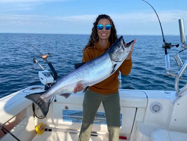 First Mate Lisa Holding 18lb King Salmon Caught during Lake Michigan Charter Fishing trip