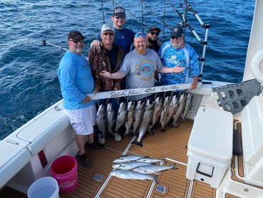 Guys trip with King Salmon and Coho Salmon caught during Lake Michigan Charter Fishing Trip