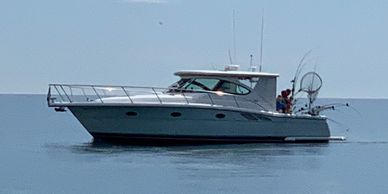 Side view of the Relentless Pursuit II, one of the newest model charter fishing boats 