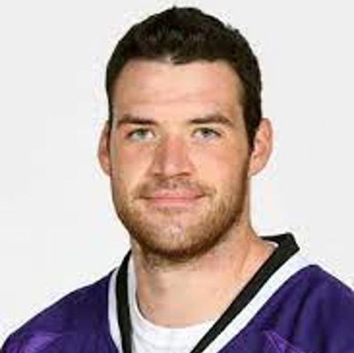 Portrait of a man in a sports jersey.