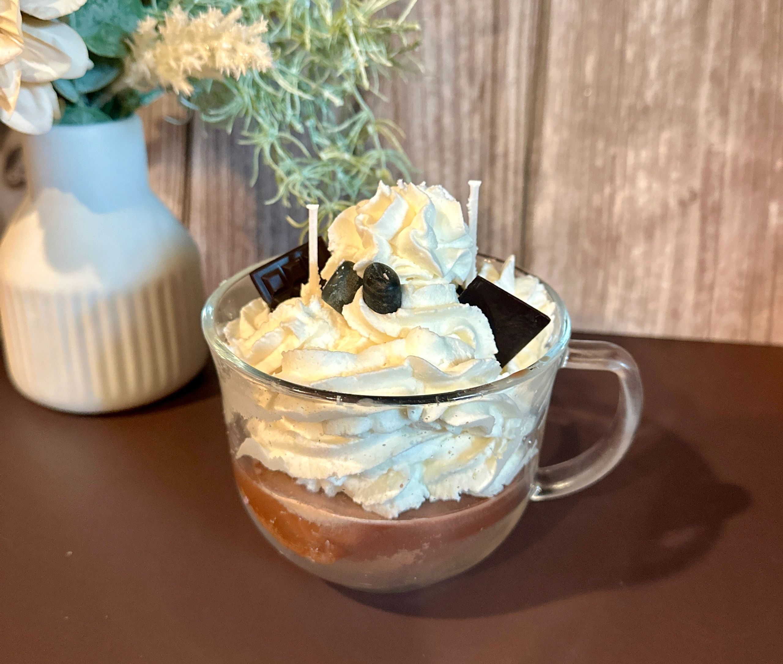 Whipped cream candle in glass mug