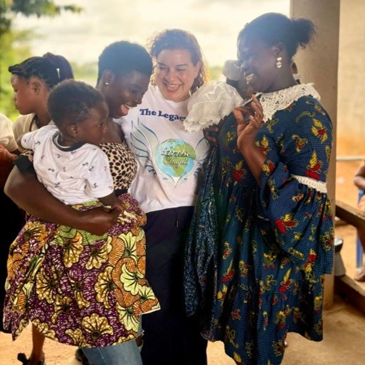 Group of happy women and children sharing joyful moment.