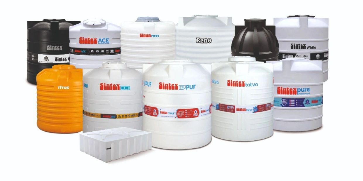 Variety of colorful Sintex water storage tanks.