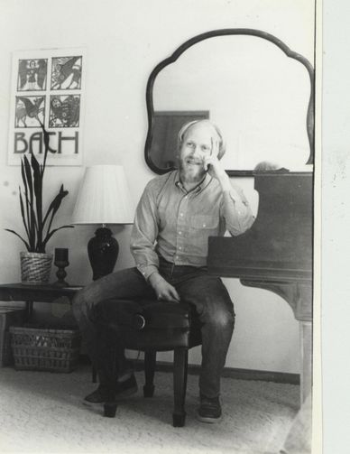 Darcy Kuronen sitting at the piano, 1985