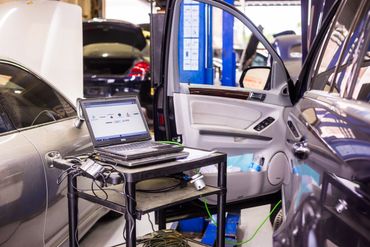 Open Car with Laptop beside