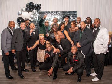 Group photo of people at a formal event.