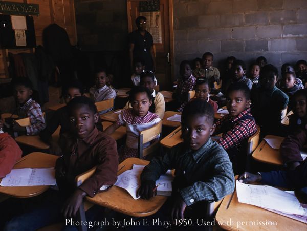 1950 classroom with attentive students and teacher.
