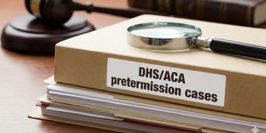 Folder labeled DHS/ACA pretermission cases with a magnifying glass and gavel.