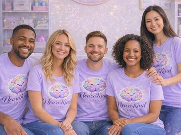A diverse group of five smiling people wearing matching lavender NeuroKind Toys t-shirts.
