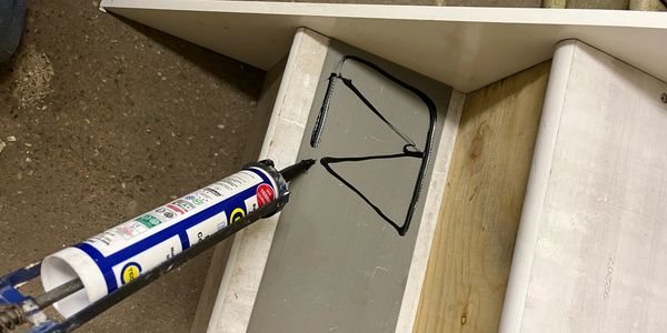 glue being added in a triangle pattern 