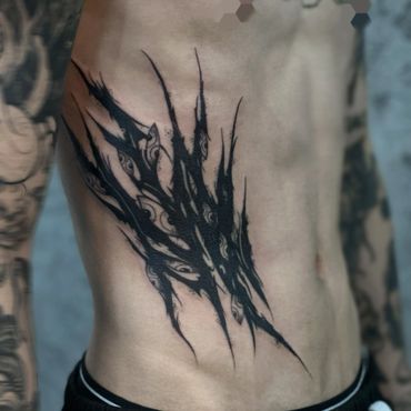 abstract dark eyes tattoo by mostro tattoo singapore, best tattoo studio in singapore