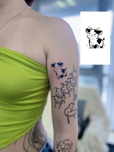 cute cow tattoo by mostro tattoo singapore, best tattoo studio in singapore