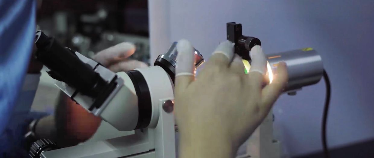 Sunlight Medical staff making a micropipette.