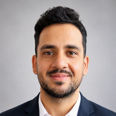 Portrait of a smiling man in a suit.