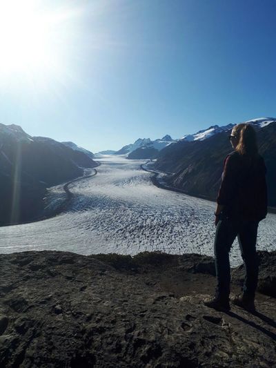 Geologist explores a glacier in northern British Columbia