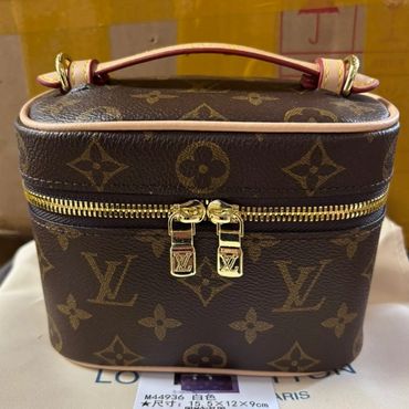 Louis Vuitton brown monogrammed cosmetic case with gold zipper and handle.