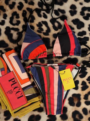 Colorful striped Pucci bikini and matching scarf on leopard print background.