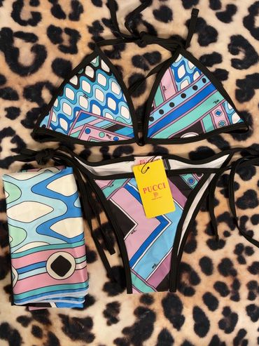 Colorful Pucci bikini set with geometric patterns on leopard print background.