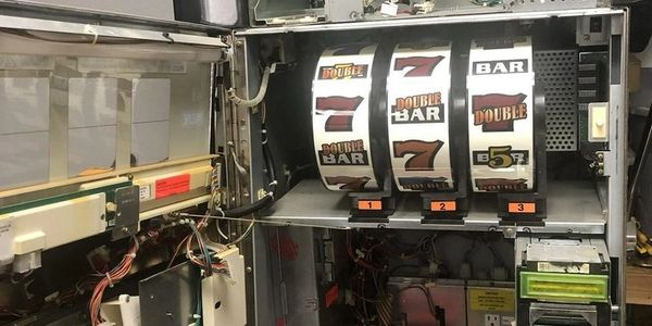 Slot machine being repaired