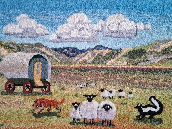 Painting of wagon and sheep.

