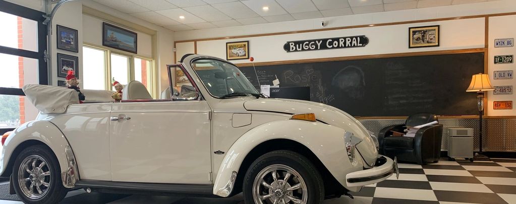 white VW convertible in garage