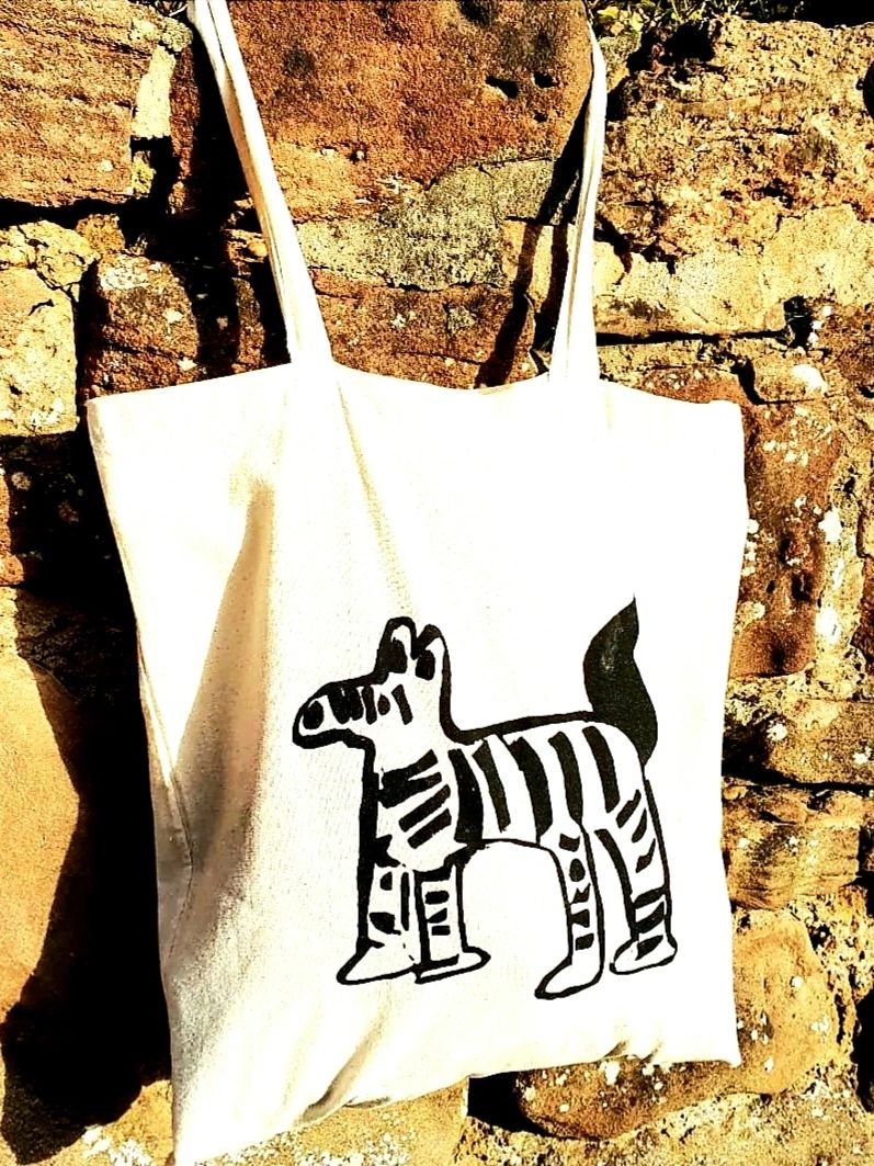 Screen-printed zebra on a tote bag.