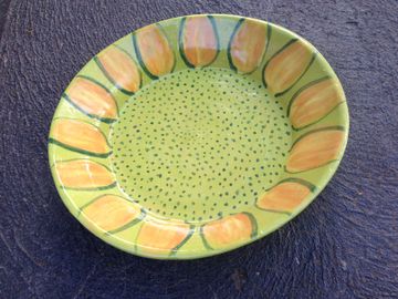 Wheel thrown dish with hand painted underglaze decoration