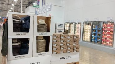 Retail display of ADV Quest shoes and apparel in a store aisle.