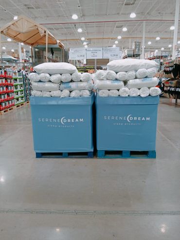 Two large bins filled with Serene Dream sleep products in a warehouse store.