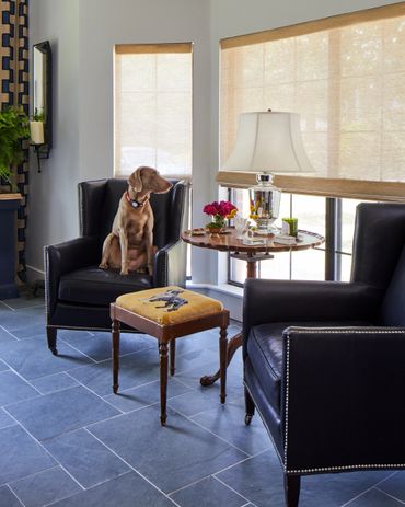 Black leather chairs with woven shades and antique table 
