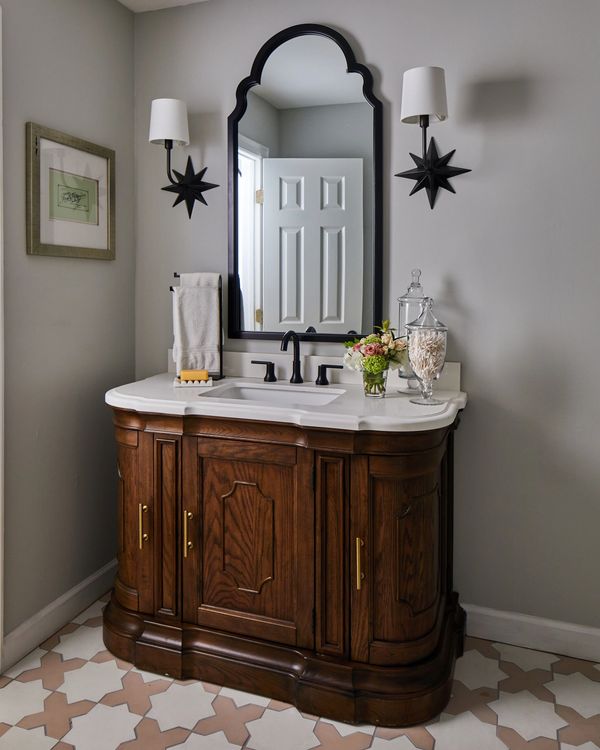 Star sconces with wood and marble vanity 