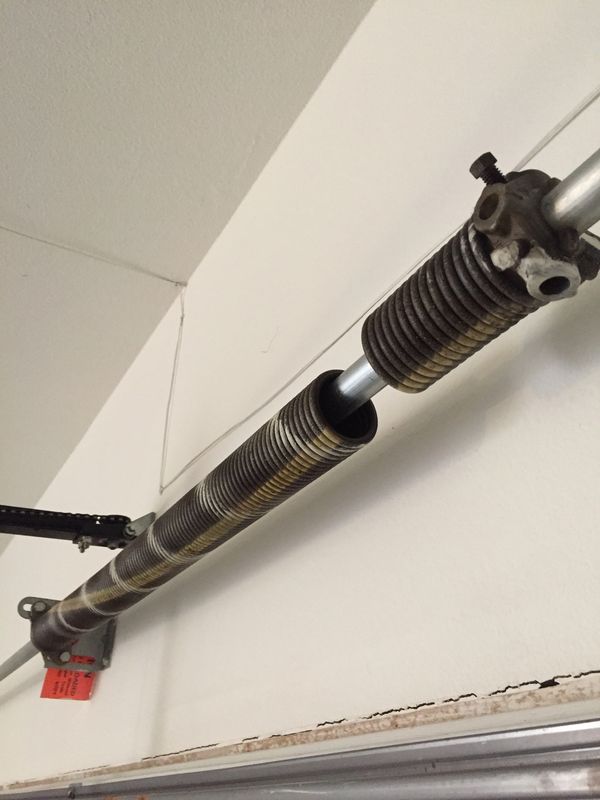 Door won’t open? Goes up about a foot and drops back down? Broken Torsion spring!! 