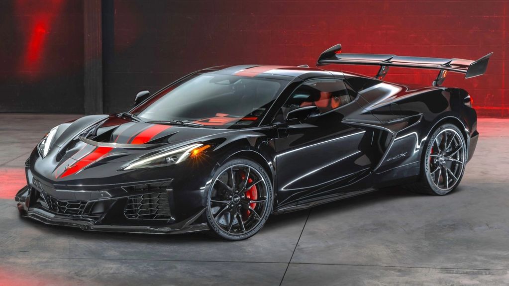 Sleek black sports car with red racing stripes and a large rear spoiler.