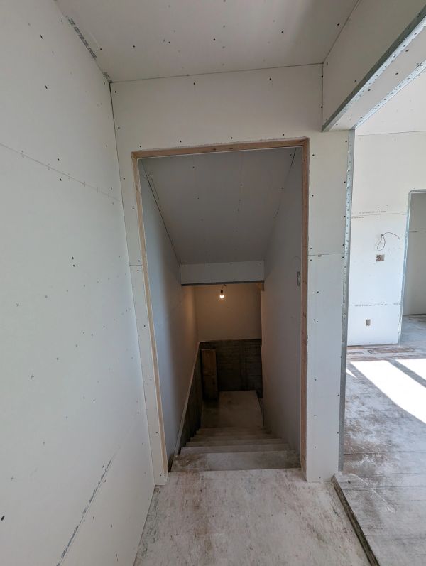 Staircase under construction inside a building.