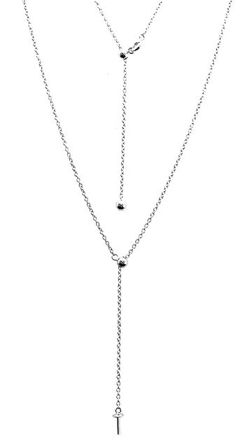 Delicate silver Y-shaped layered necklace with a small cross pendant.