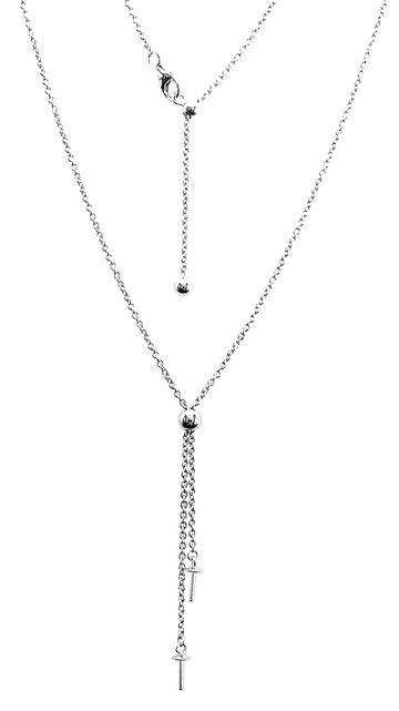 Elegant silver necklace with cross pendants and adjustable chain.