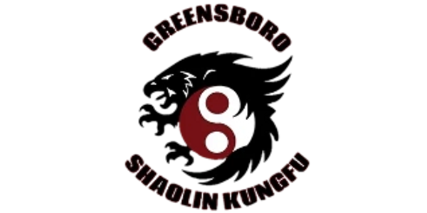 Logo of Greensboro Shaolin Kung Fu with dragon and yin-yang symbol.