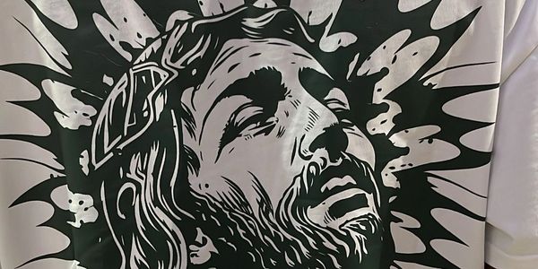 A white t-shirt featured a powerful Jesus Christ logo on the back