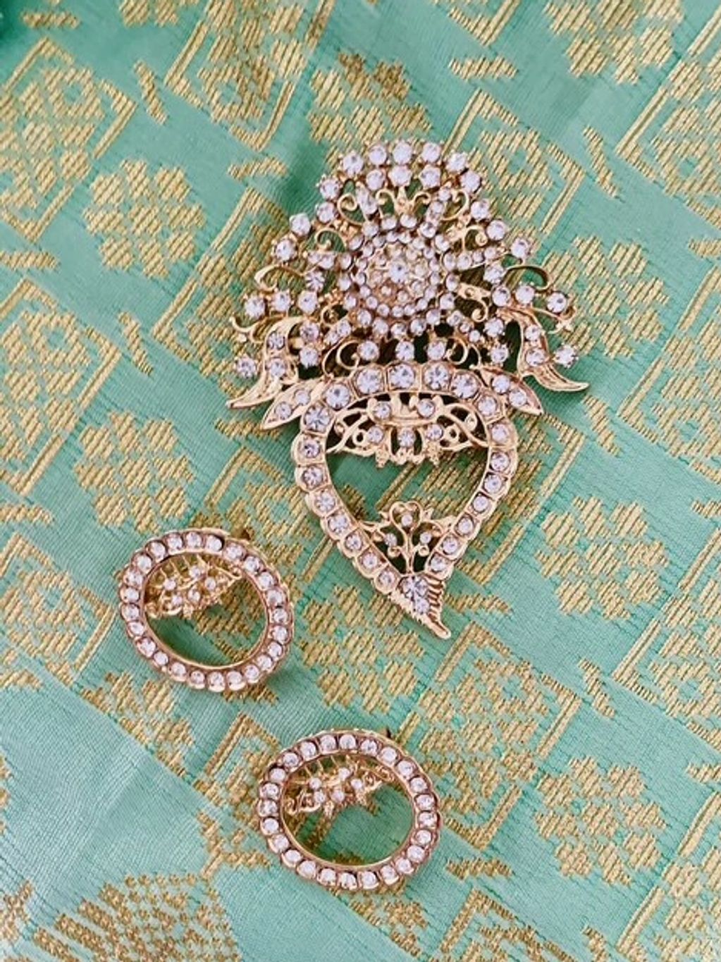 A traditional Kerosang Thoe (peach) and accompanying anak (children). This vintage-inspired set can 