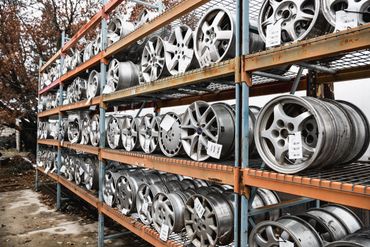 hubcaps stacked on shelves 2