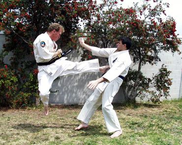 Doug Turnbull doing jumping kick showing Focus and power