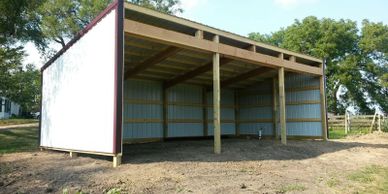 sturdy metal building enclosure, hay barn or livestock housing