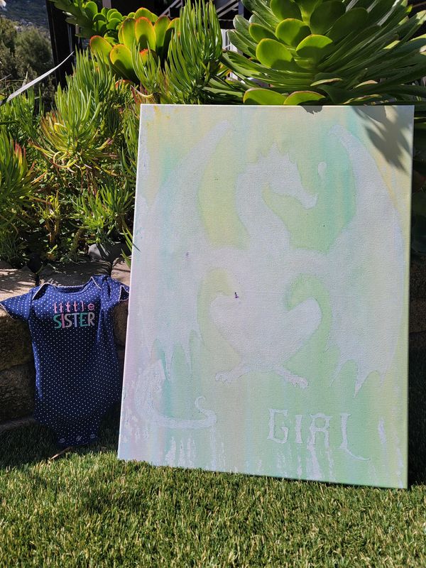 Baby onesie with 'little sister' and a pastel painting with 'girl' and a dragon silhouette.