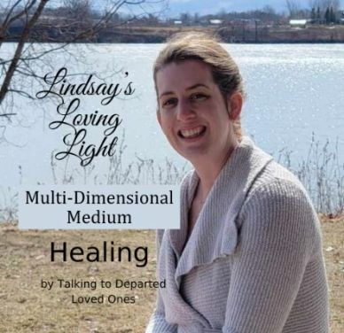 Woman smiling by a lake promoting healing through talking to departed loved ones.