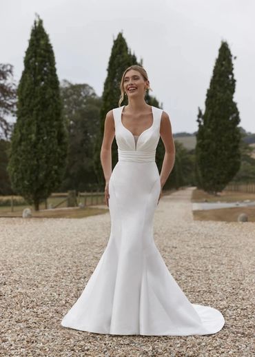 Satin fit-and-flare wedding dress with pleated waist