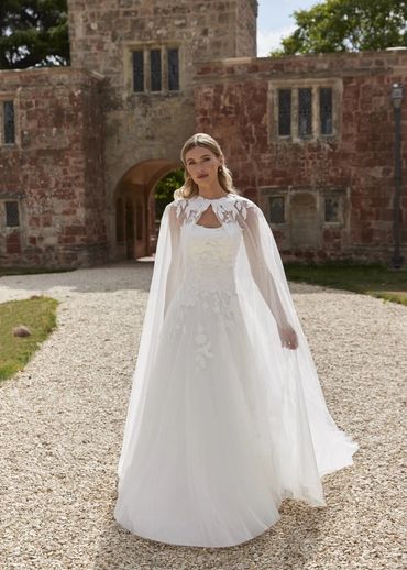 Lace wedding dress with sheer floral cape