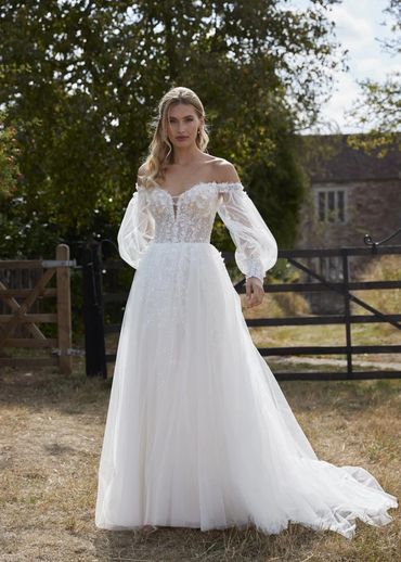 Off-shoulder tulle wedding dress with sheer bishop sleeves