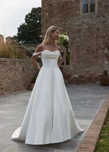 Off-shoulder satin A-line wedding dress with pearl straps