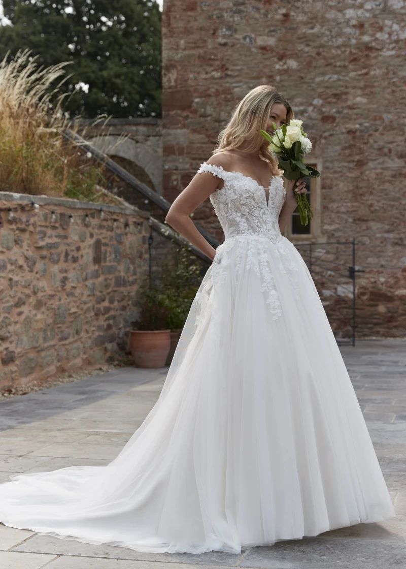 Off-shoulder lace ball gown wedding dress, plus size wedding dresses in sizes 6 to 32 at K.T. Bridal