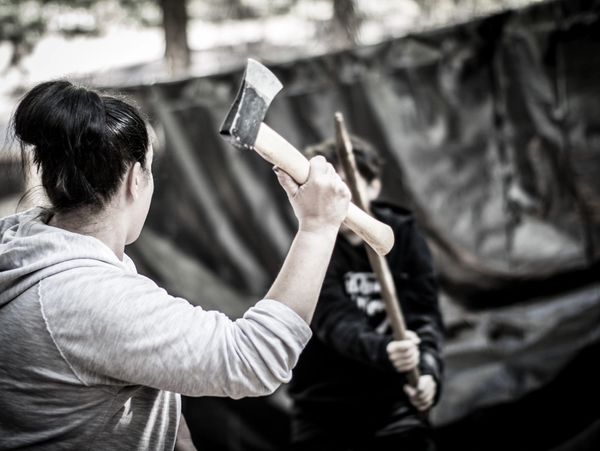 Our family swinging an axe and sticks at each other 